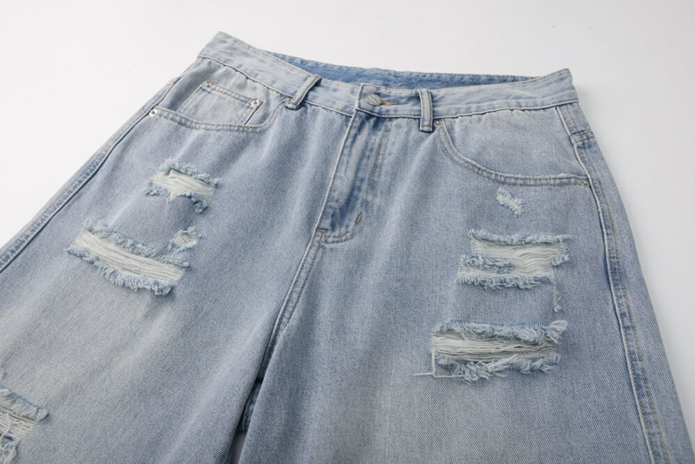 vintage light blue denim shorts with holes